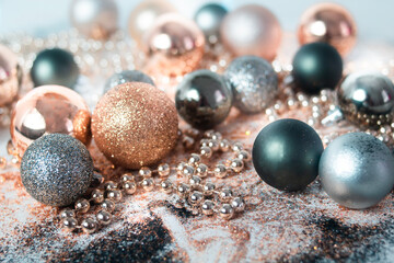 Silver, green, and gold Christmas baubles