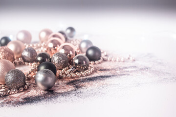 Silver, green, and gold Christmas baubles
