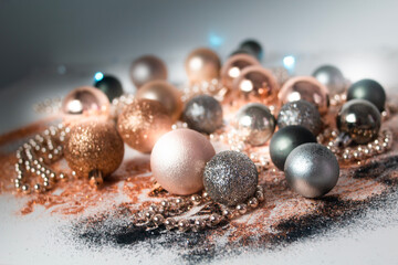 Silver, green, and gold Christmas baubles