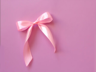 Pink satin bow on pastel pink background. valentine day greeting card with copyspace