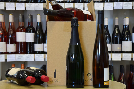 The wine is put in a box and ready for home delivery. Wine bottles in wine store .