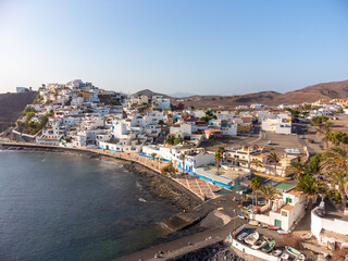 Fototapeta na wymiar Aerial view of the beach and the coastal town of Las Playitas, east coast of the island of Fuerteventura, Canary Islands. Spain