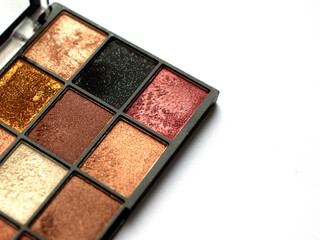 Make-up eye shadow palette close up. Professional multicolor eyeshadow palette. Makeup. Professional multicolor eyeshadow make up palette background. Colorful bright eye shadows set backdrop