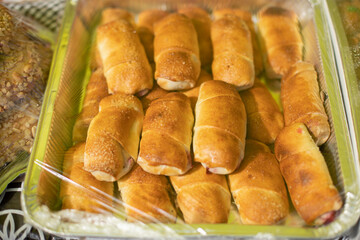 Sweets packed in film. Sale of delicious food. Boxes of sugar treats.