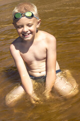 boy bathes on a sunny summer day