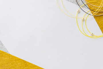 寅のイメージカラーの水引と金銀の千代紙の和紙背景