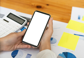 Top view Mockup image hand using a smartphone man Holding Cell Phone With Blank Screen