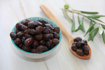 oily black olives with a stone