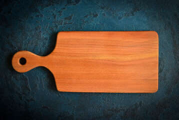 empty wooden old textured cutting board on concrete table for desidn , mock up for copy space text, food concep and table setting blank