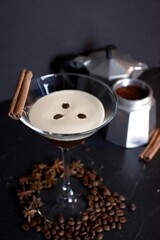 Espresso martini cocktail with cinnamon sticks