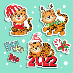 Cute cartoon baby tigers in a santa claus hat collection. Vector illustration isolated. T-shirt design. Concept christmas, chinese new year, symbol of 2022. Fashion patch badges