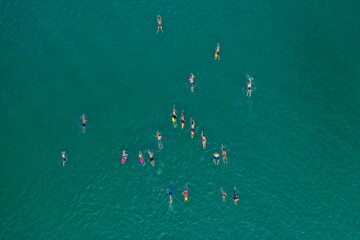Large group of Swimmers crossing the Sea of Galilee, Aerial view.
