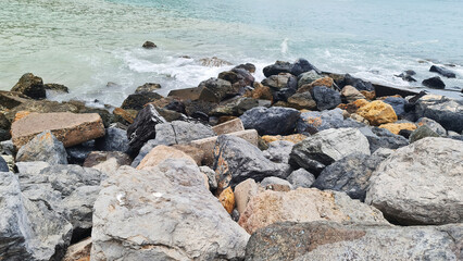 Fototapeta na wymiar coast line and stones on the beach shore