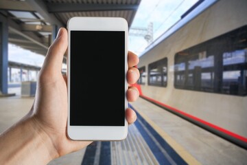 Traveler holds vaccine passport certificate, blank screen smartphone, travel during coronavirus pandemic .