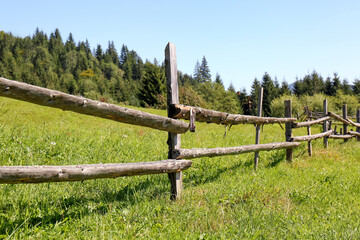 Beautiful view of mountain countryside with wooden fence