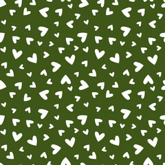 Green seamless pattern with white hearts.