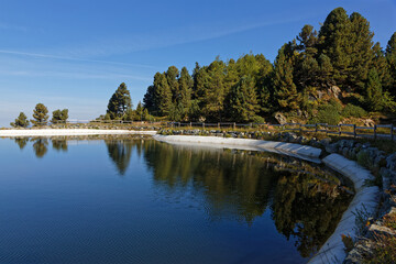 Lac des Vallons is an artificial lake whose waters are conserved to feed snow cannons in winter