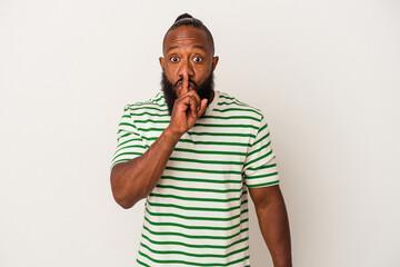 African american man with beard isolated on pink background keeping a secret or asking for silence.