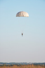 Skydiver activity sport jump on the blue sky background