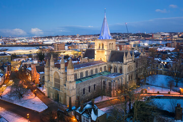 Aerial view of Rochester cathedral and snow covered historical Rochester in winter evening.