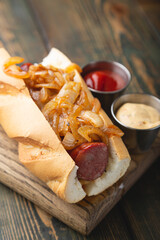 Hotdog with smoked sausage and fried onions