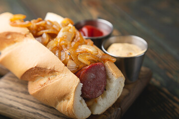 Hotdog with smoked sausage and fried onions