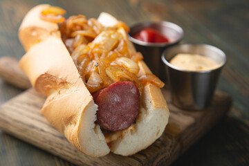 Hotdog with smoked sausage and fried onions