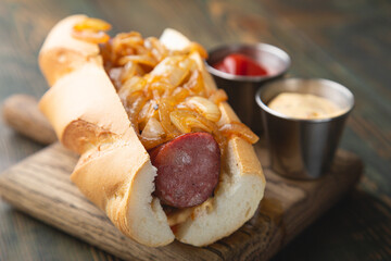 Hotdog with smoked sausage and fried onions