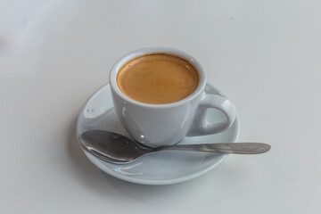 A cup of coffee for a business lunch. Nobody, isolated.