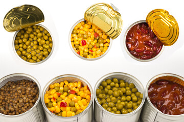 Canned food on white background. Green pea, beans, corn, lentils.