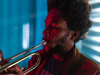 Young trumpeter performs at home