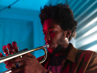 Young trumpeter performs at home