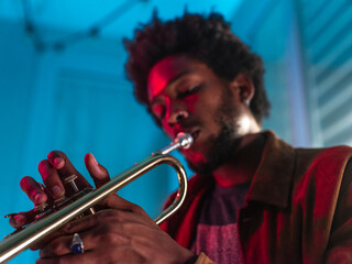 Young trumpeter performs at home