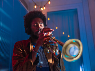 Young trumpeter performs at home