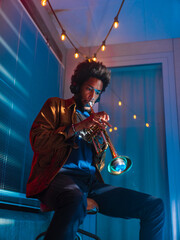 Young trumpeter performs at home