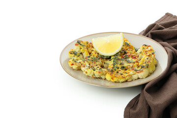Plate with baked cauliflower and kitchen towel isolated on white background