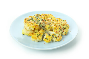 Plate with baked cauliflower isolated on white background