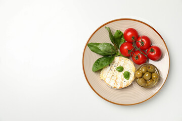 Concept of tasty food with grilled camembert on white background