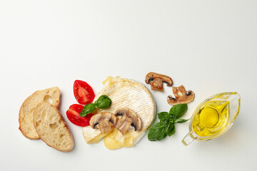 Concept of tasty food with grilled camembert on white background