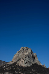 Peña de Bernal México mountain landscape with blue sky and clouds
