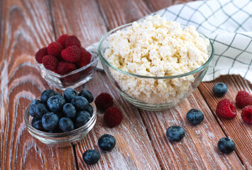 Cottage cheese and ripe berries for breakfast. Close-up.