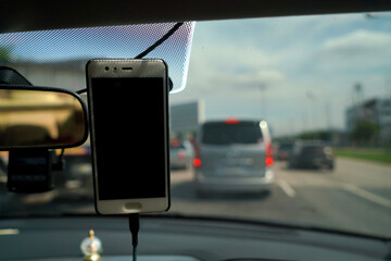 Smartphone in a car use for Maps and Navigators, Safety concept and technology.