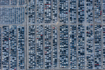 Fototapeta na wymiar Aerial view New cars parked in ports preparing for export to foreign countries,concept about the automotive industry