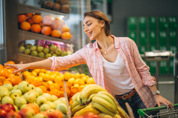 Woman buying at grocery store