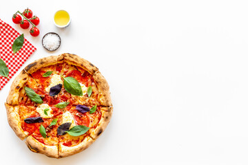 Italian pizza with tomatoes cheese and basil, top view