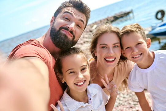 A picture of happy smiling family having fun on a beach