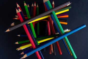Fototapeta premium colored pencils on a black background