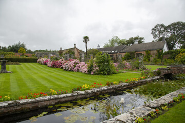 country living flower garden with water fountain
