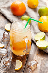Citrus lemonade. On a wooden table.