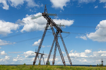 electricity pylon. High voltage Transmission tower line support in the field.